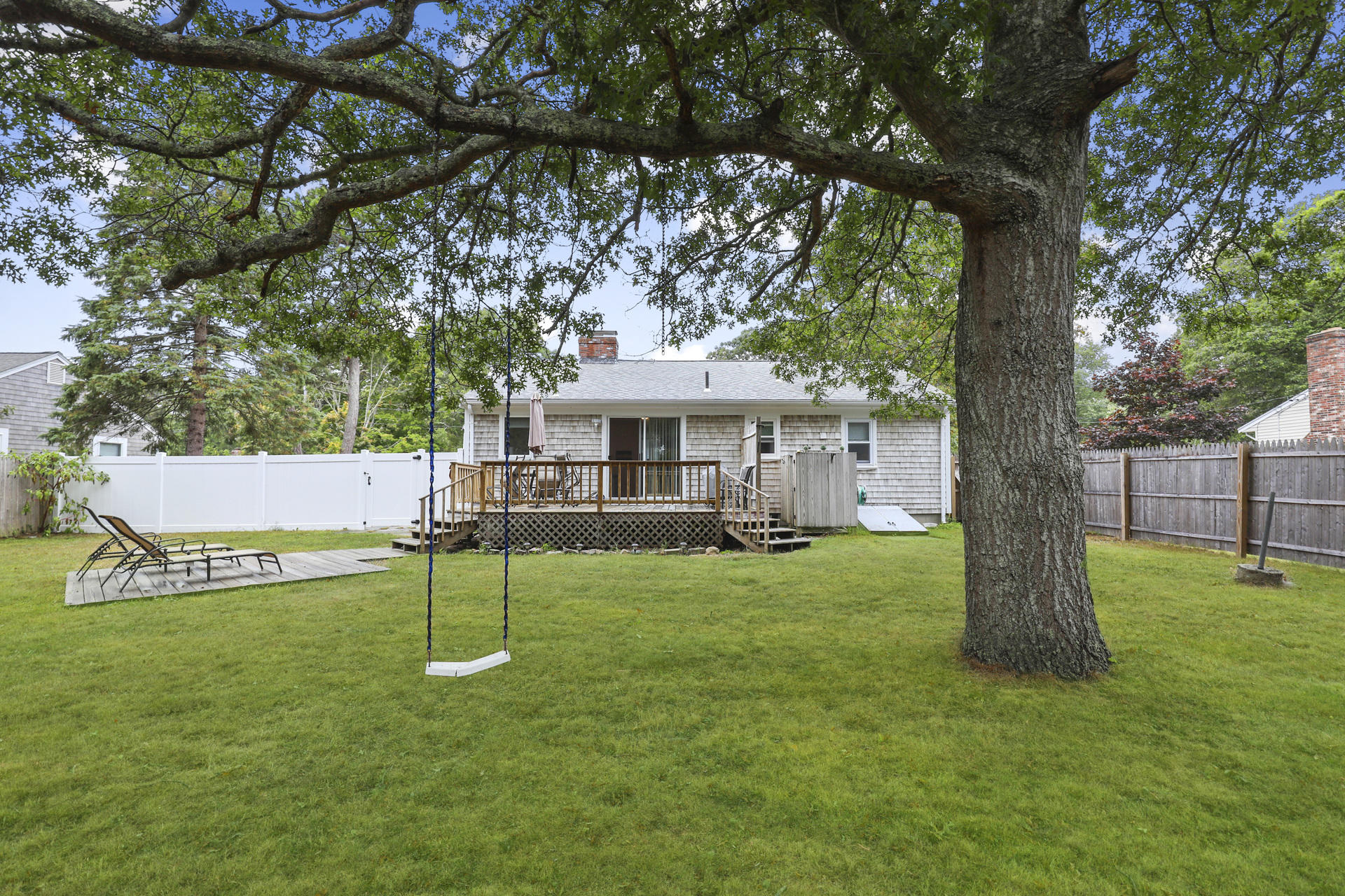 236 Megan Road Hyannis, MA 02601 - Photo 17 of 20 a view of a house with a backyard and a tree