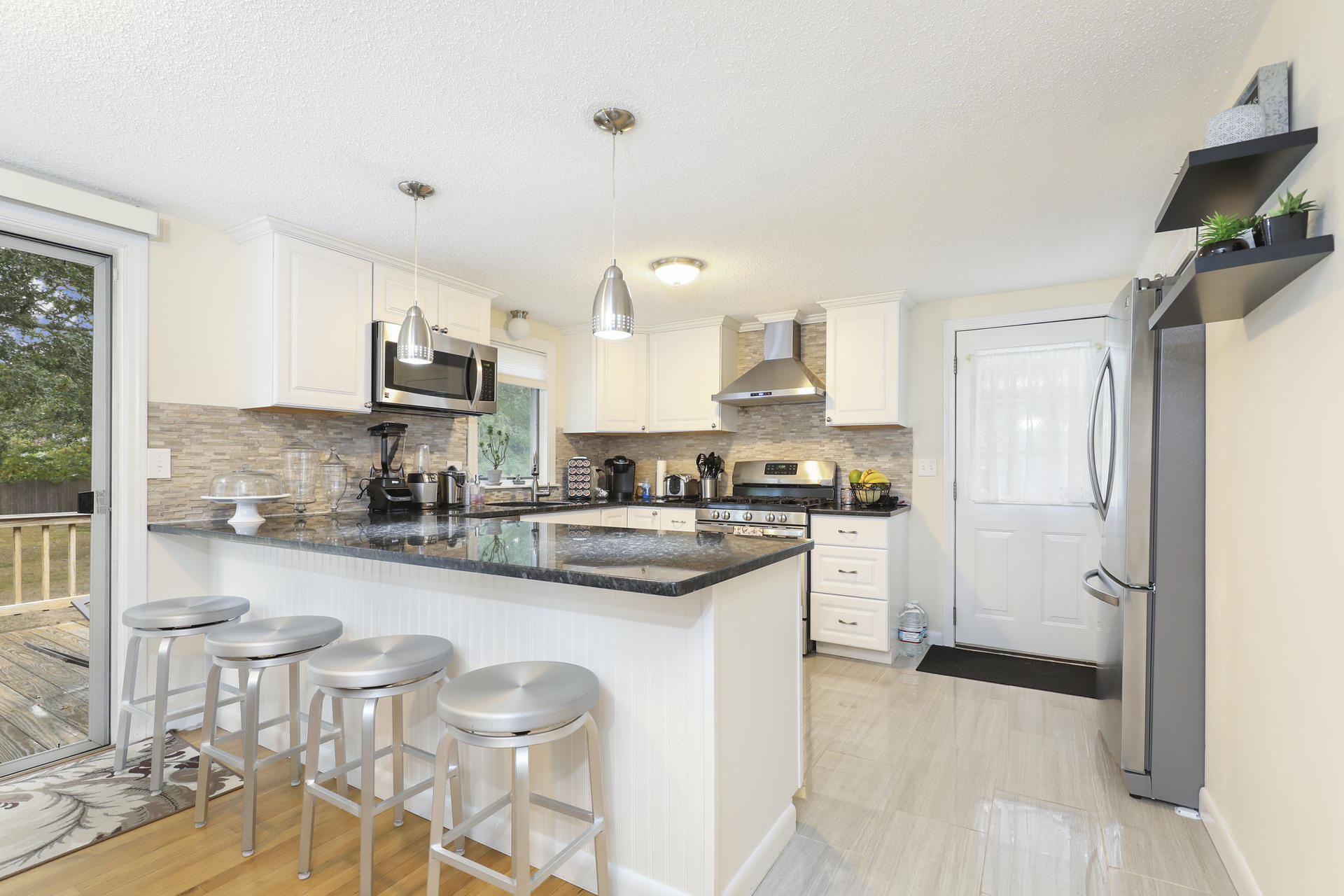 236 Megan Road Hyannis, MA 02601 - Photo 6 of 20 a kitchen with stainless steel appliances granite countertop a sink and cabinets