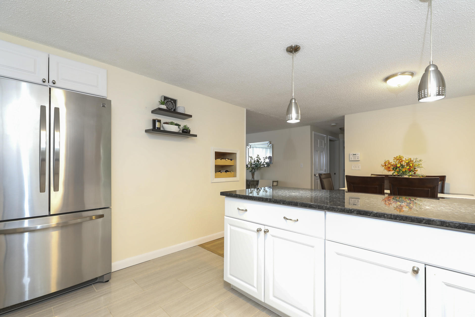 236 Megan Road Hyannis, MA 02601 - Photo 7 of 20 a kitchen with kitchen island a counter top space appliances and cabinets