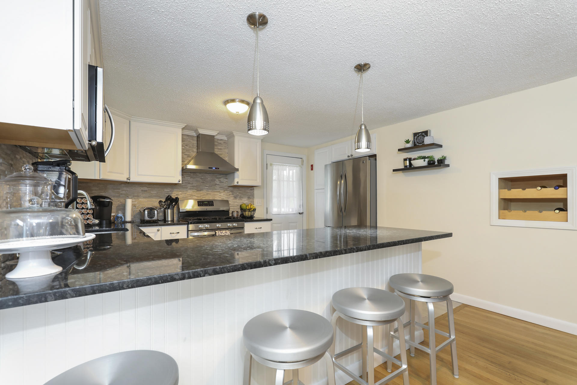 236 Megan Road Hyannis, MA 02601 - Photo 9 of 20 a kitchen with a table and chairs in it