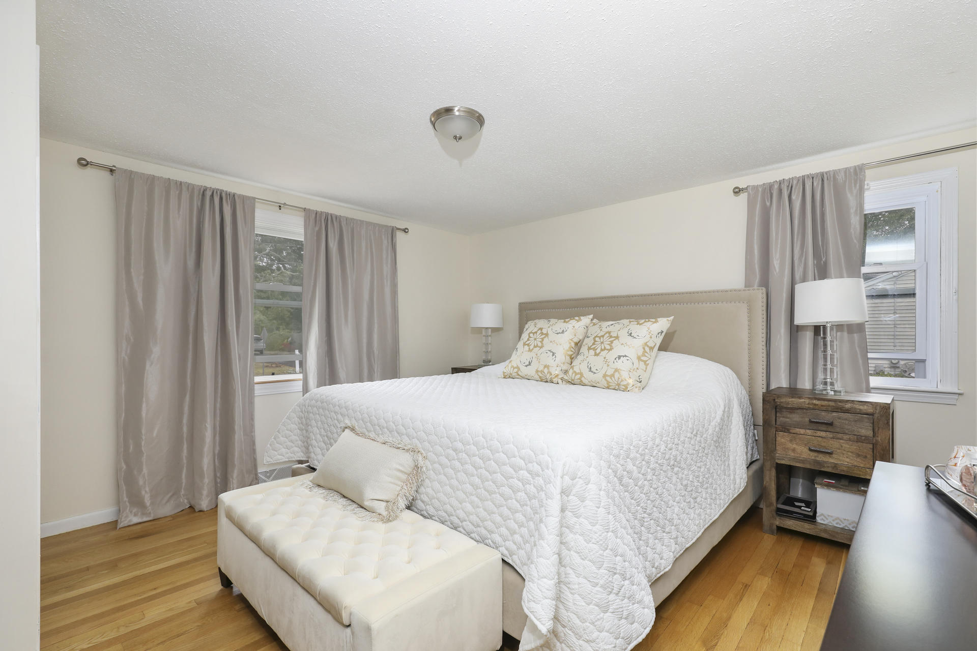 236 Megan Road Hyannis, MA 02601 - Photo 10 of 20 a bedroom with a bed and wooden floor