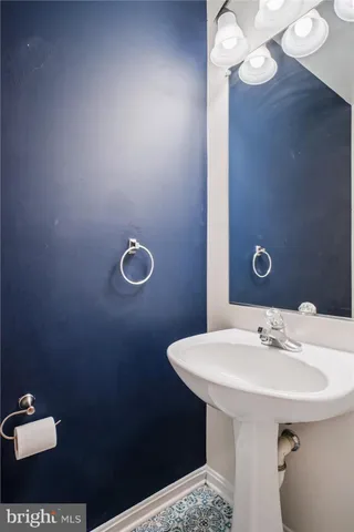 a view of a hallway with wooden floor and entryway