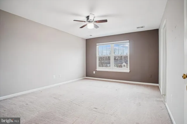 a view of a big room with carpet