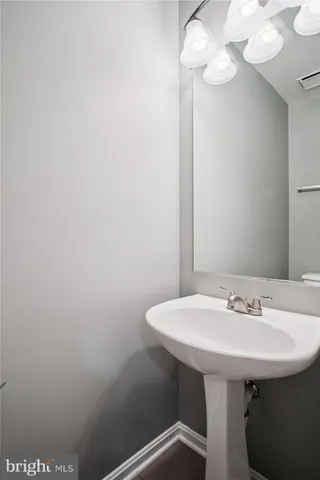 an empty room with sliding glass door and shower