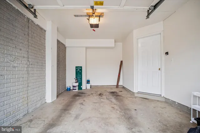a view of a patio with couches table and chairs and potted plants