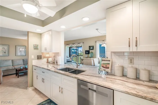 a kitchen with sink and cabinets