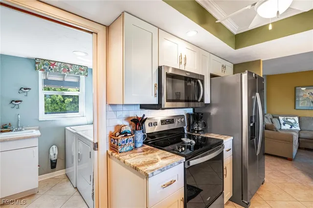 a kitchen with a sink stove and refrigerator