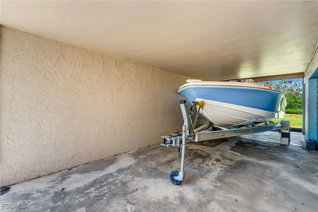 a living room with furniture and a ceiling fan