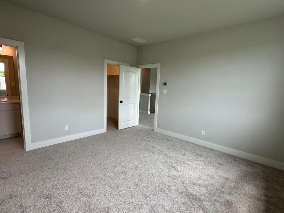 390 Cobb Road Leonard, TX 75452 - Photo 22 of 26 Expansive room featuring plush grey carpeting and light grey wall finishes