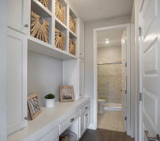 a kitchen with a refrigerator and a sink