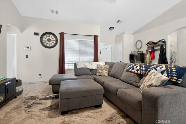 a kitchen with stainless steel appliances granite countertop a refrigerator and a stove