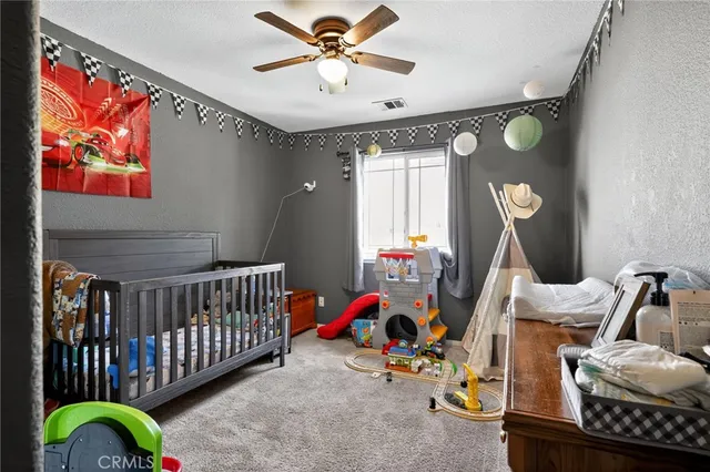 a bedroom with bed and cabinets