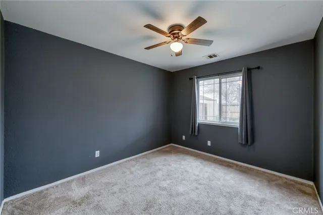 a bathroom with a double vanity sink toilet and a mirror