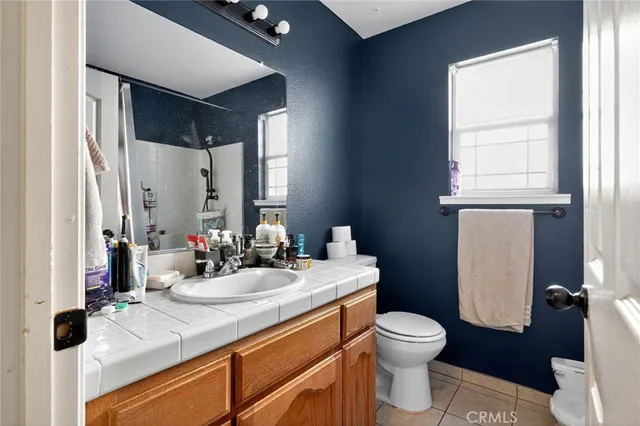 a bedroom with a workspace