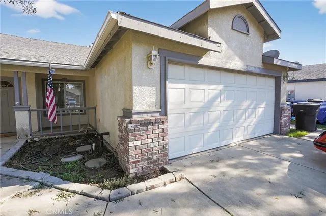 a house that has sitting area in front of it