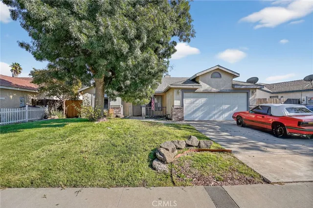 a view of a backyard with swimming pool