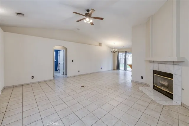 a view of an empty room with a kitchen