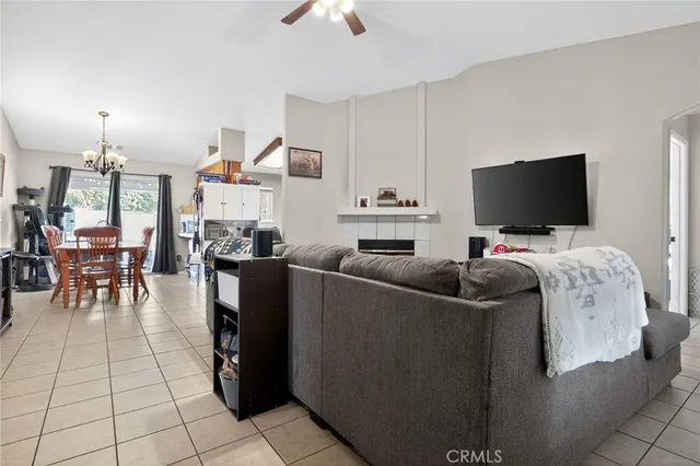 a living room with furniture a clock and a mirror