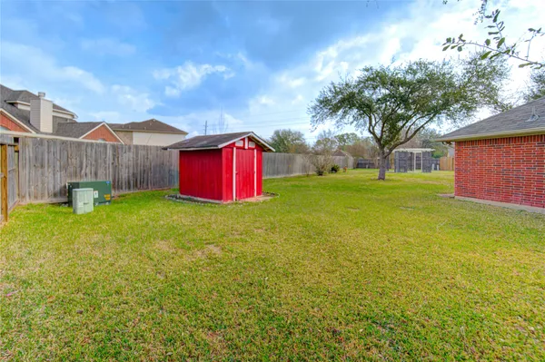 a view of a house with a back yard
