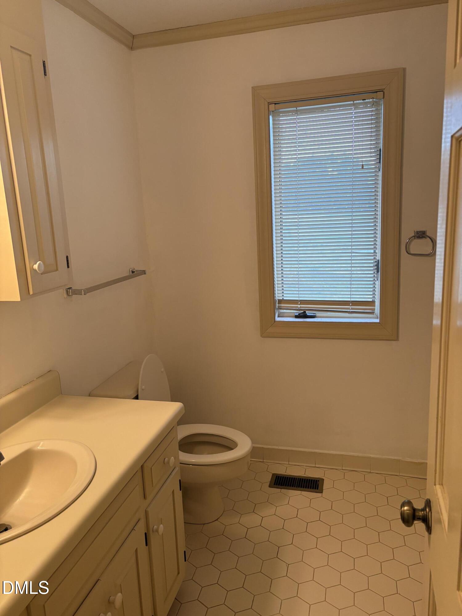 7213 Ridgefield Court Sanford, NC 27332 - Photo 11 of 17 a bathroom with a granite countertop toilet and a sink