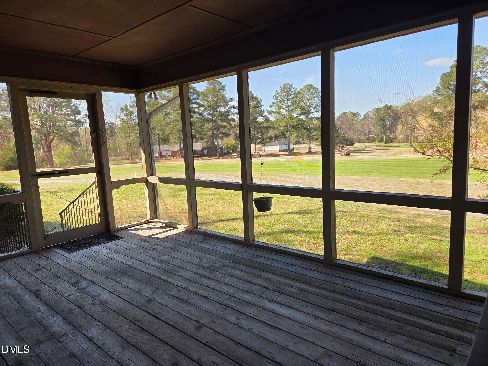 7213 Ridgefield Court Sanford, NC 27332 - Photo 13 of 17 a view of an empty room with wooden floor and a large window with wooden floor