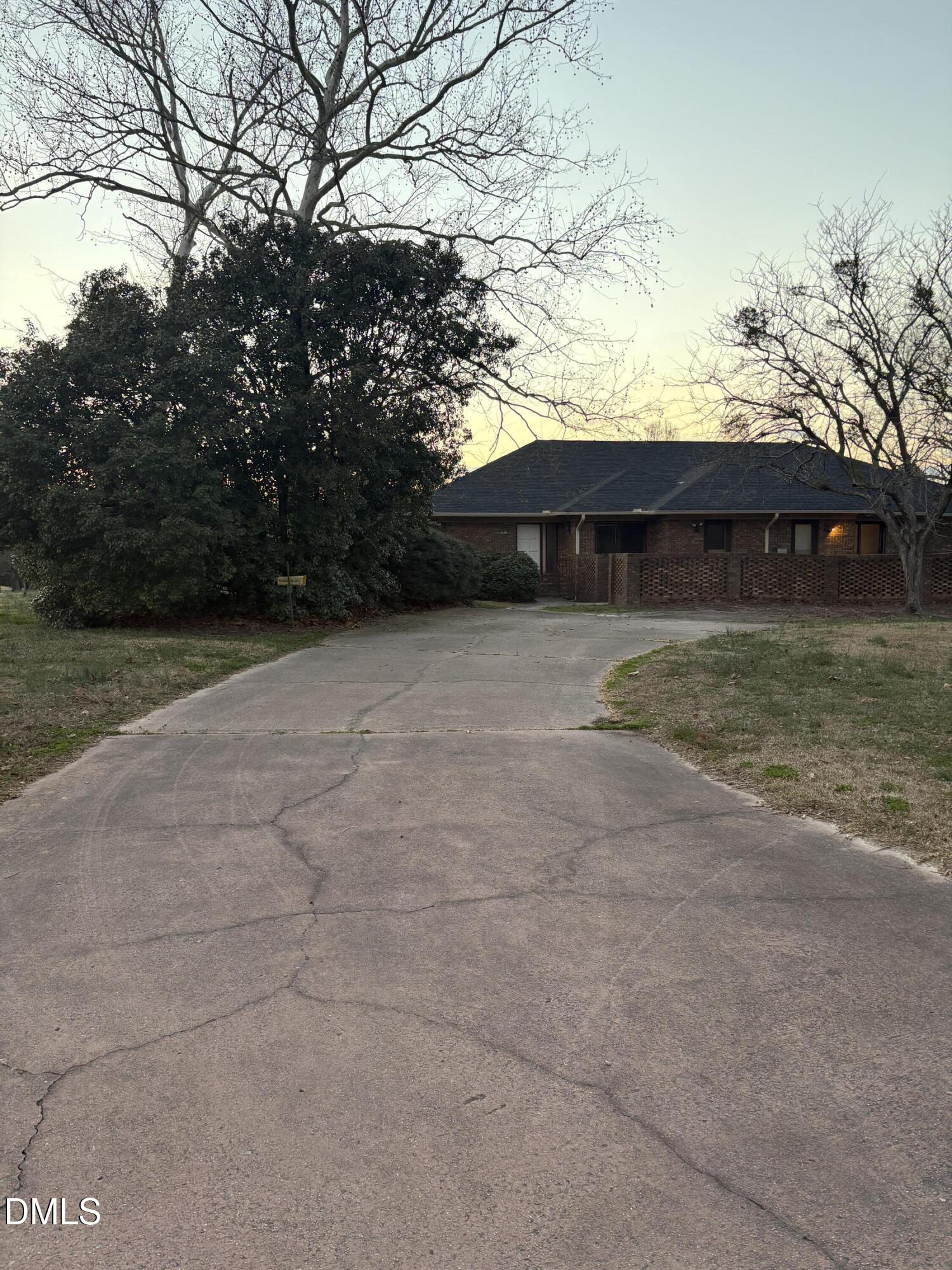 7213 Ridgefield Court Sanford, NC 27332 - Photo 17 of 17 a backyard of house with large trees