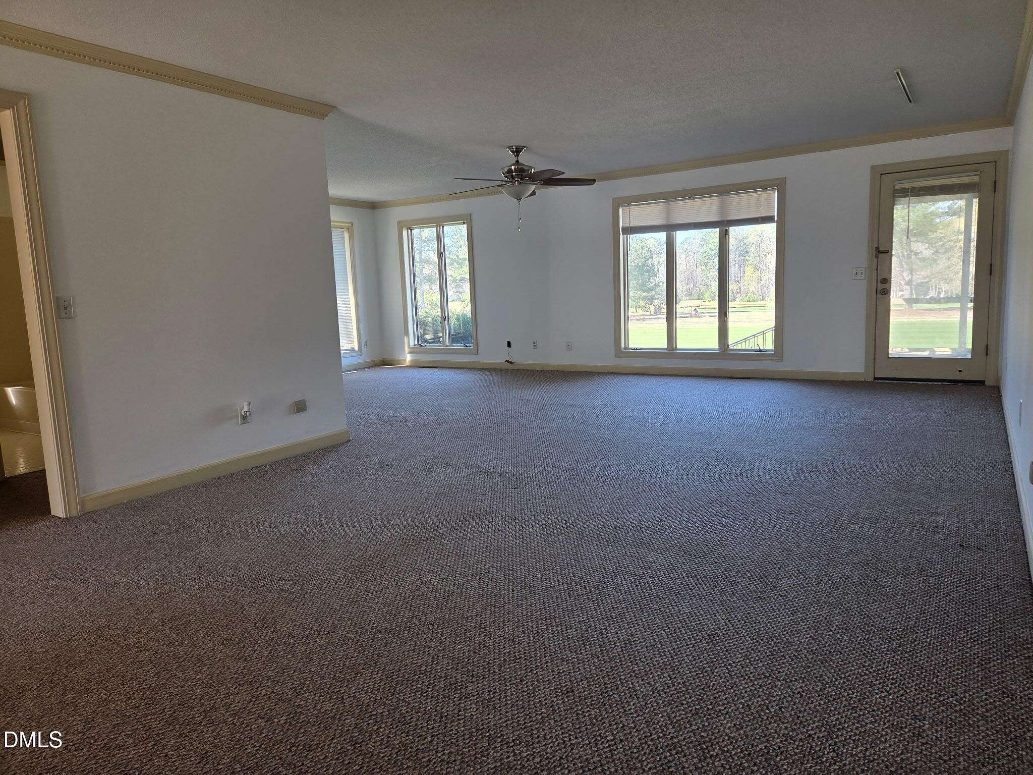 7213 Ridgefield Court Sanford, NC 27332 - Photo 2 of 17 an empty room that has a window