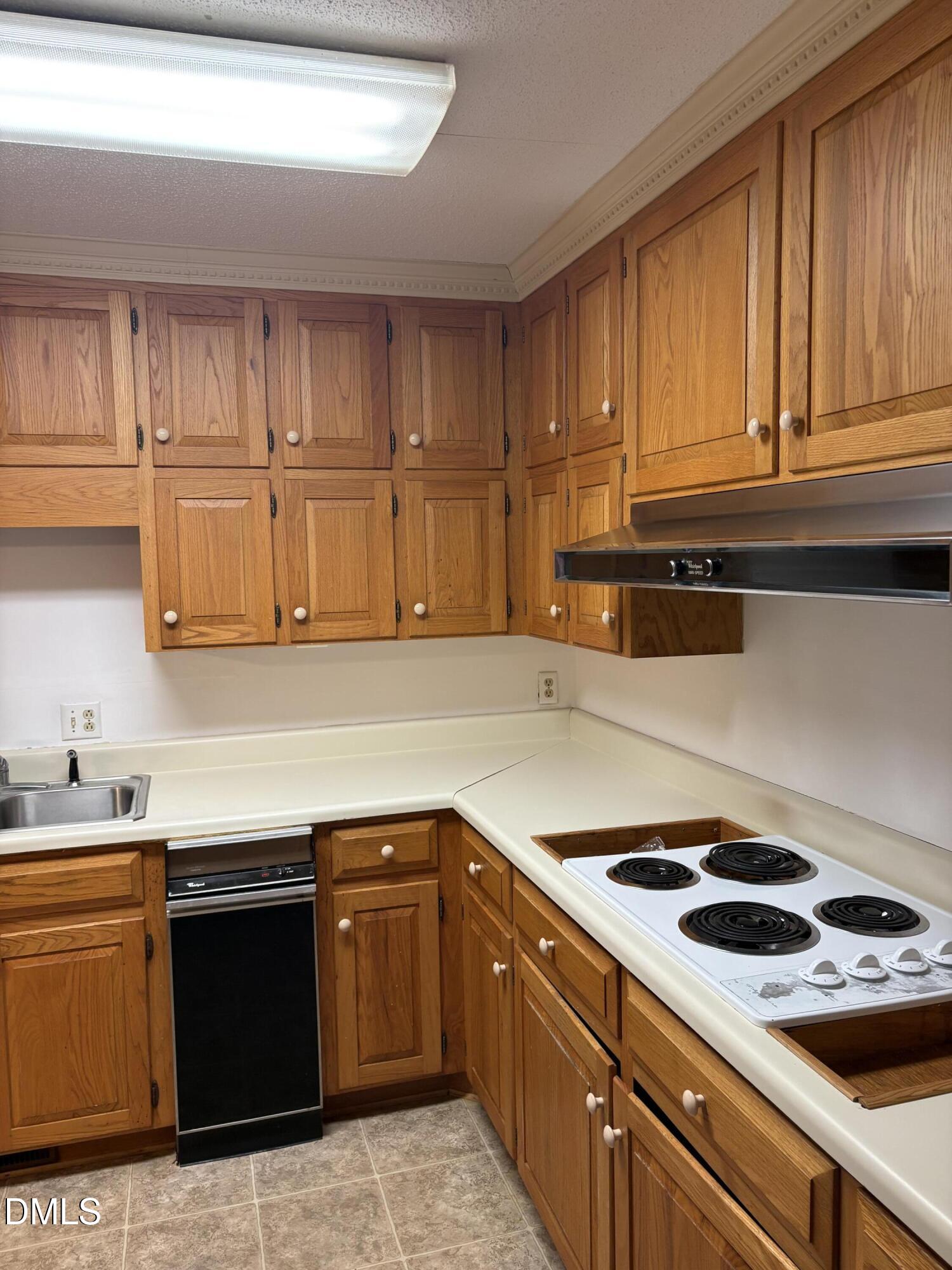 7213 Ridgefield Court Sanford, NC 27332 - Photo 4 of 17 a kitchen with stainless steel appliances granite countertop a sink stove and cabinets