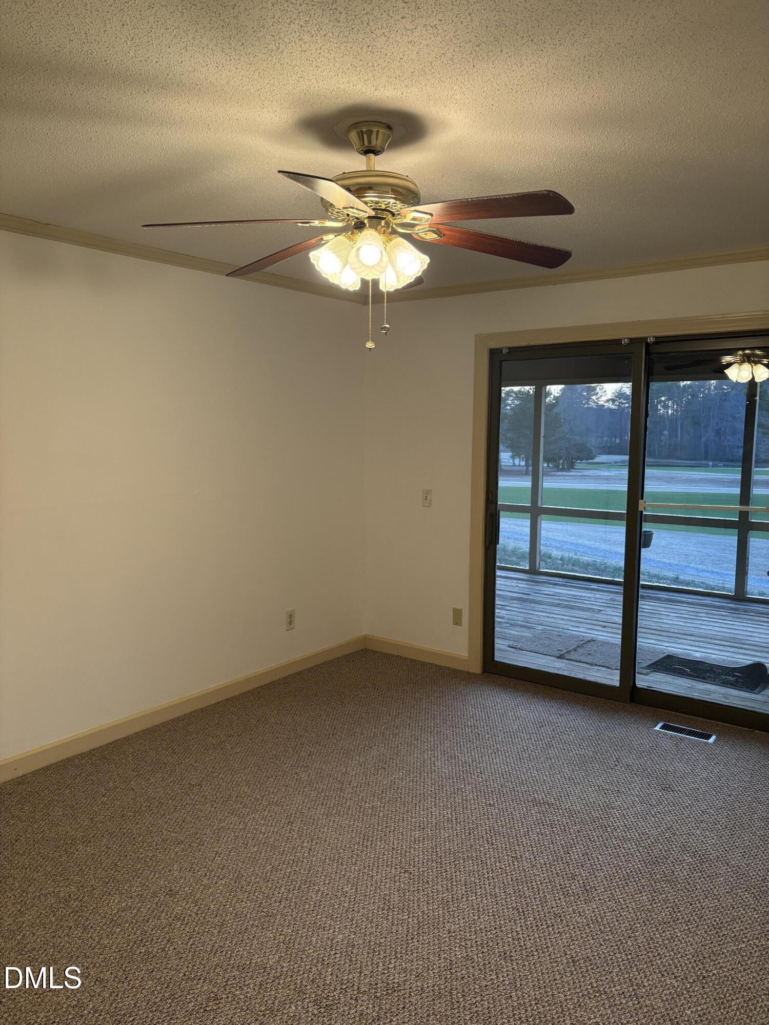 7213 Ridgefield Court Sanford, NC 27332 - Photo 6 of 17 a view of an empty room with a window