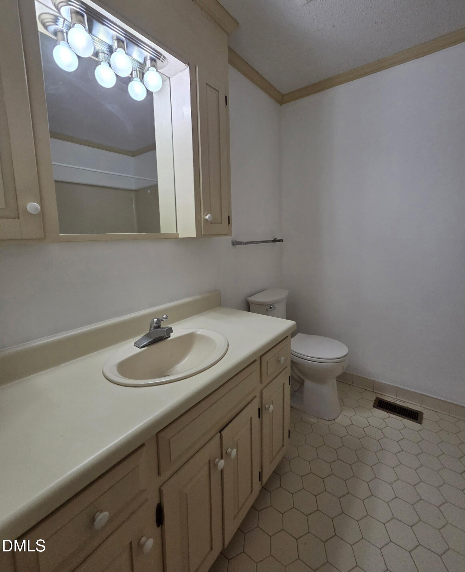 7213 Ridgefield Court Sanford, NC 27332 - Photo 8 of 17 a bathroom with a sink and a mirror
