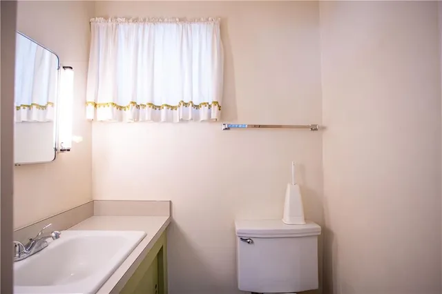 a bathroom with a sink a toilet and tub