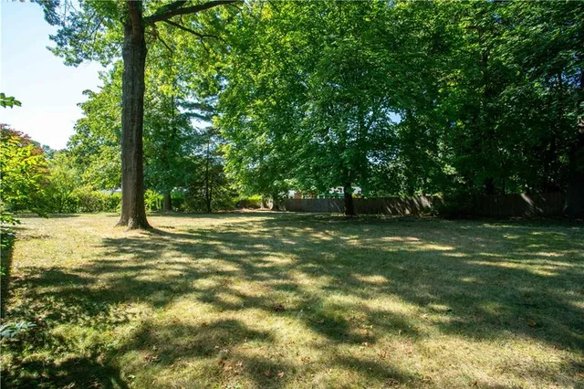 a view of outdoor space with trees all around