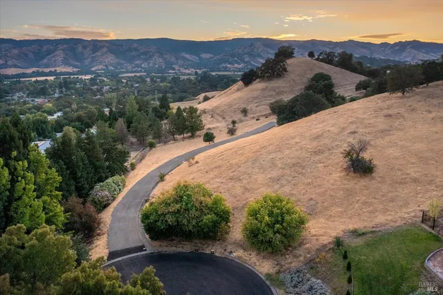 a view of a street with a mountain in the background
