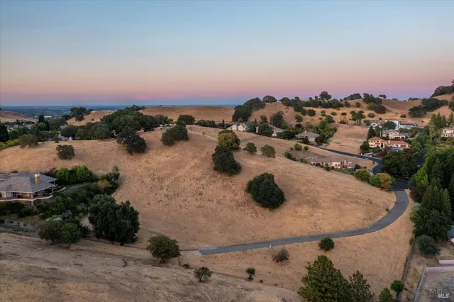 an aerial view of a house with outdoor space