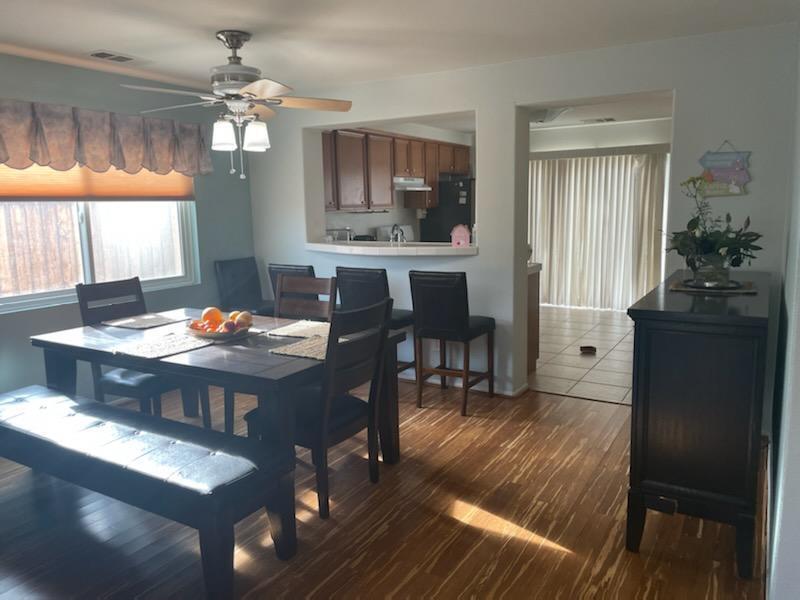 1484 Gemini Avenue Thermal, CA 92274 - Photo 12 of 26 a view of a dining room with furniture window and wooden floor