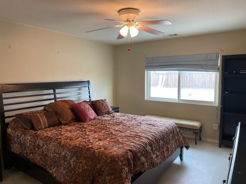 1484 Gemini Avenue Thermal, CA 92274 - Photo 14 of 26 a bedroom with a bed and a window