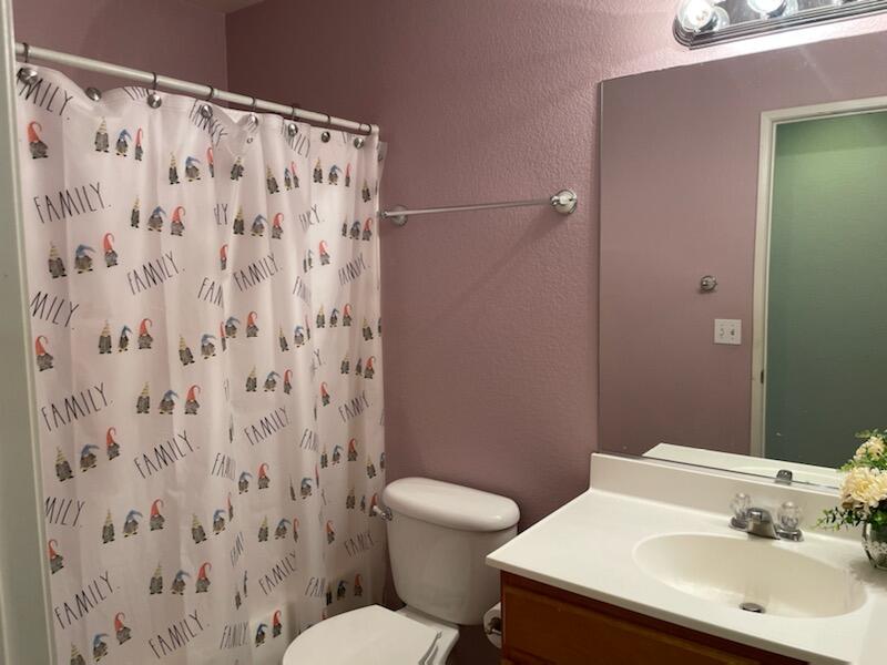 1484 Gemini Avenue Thermal, CA 92274 - Photo 15 of 26 a bathroom with a sink and a mirror