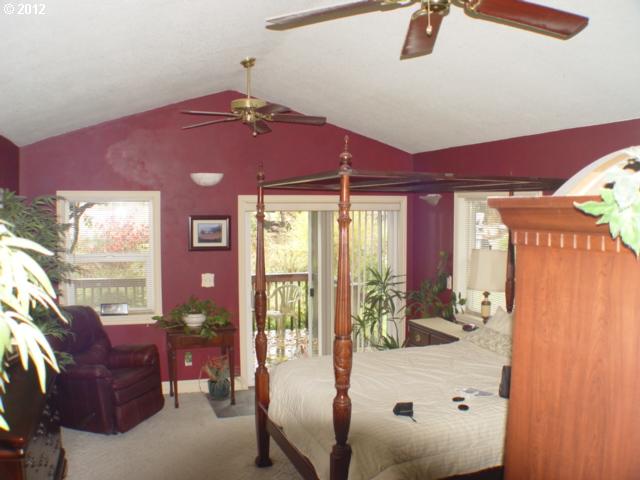 18137 Southeast Tillstrom Road Damascus, OR 97089 - Photo 7 of 15 a living room with furniture and a window