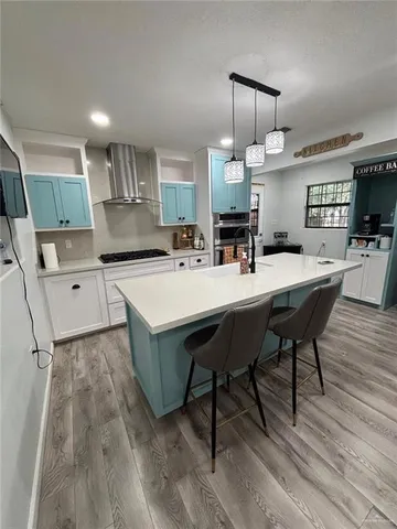 a kitchen with a sink a counter space and appliances