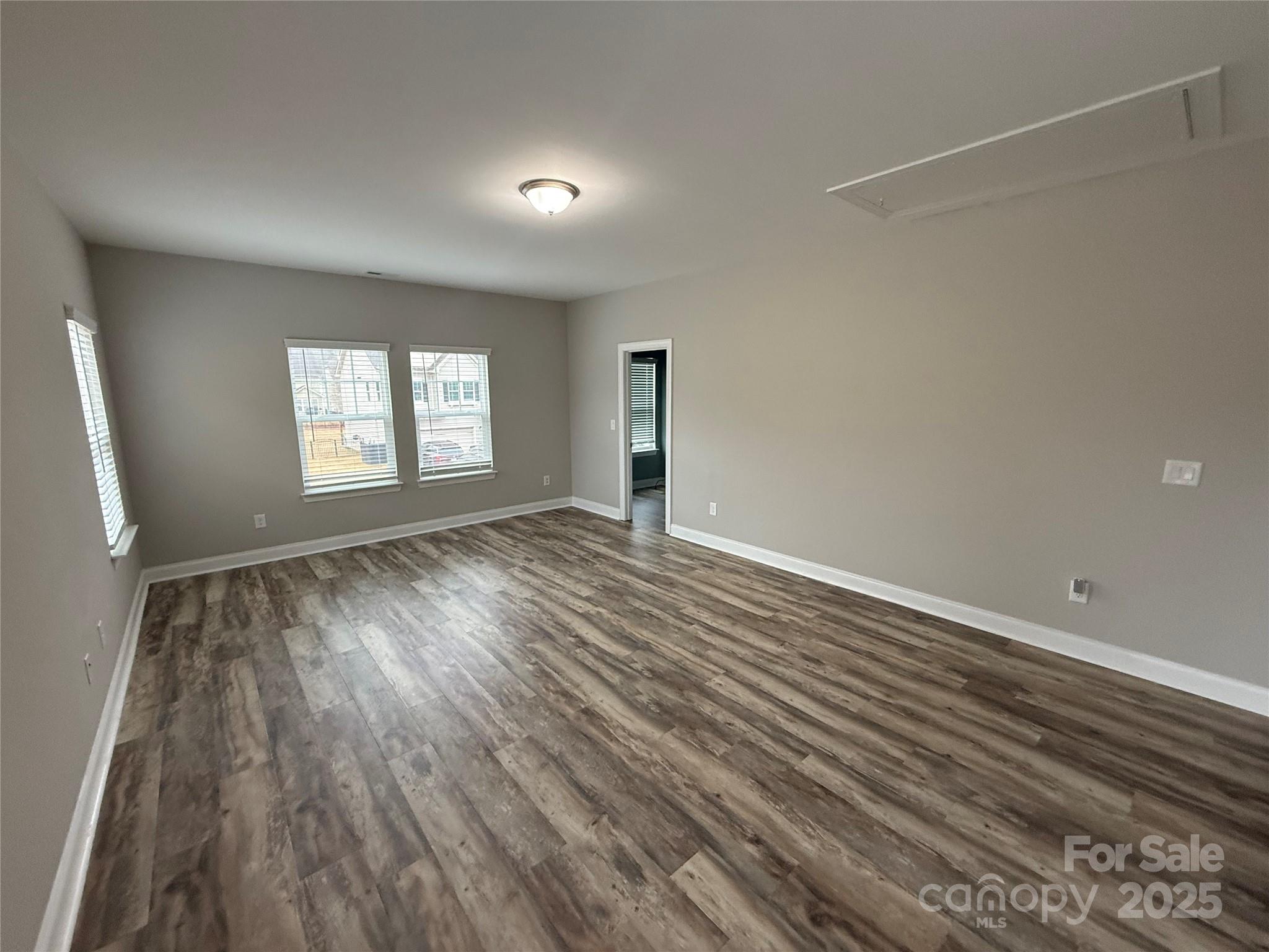 1073 Moonlight Mist Road Belmont, NC 28012 - Photo 13 of 20 wooden floor in an empty room with a window