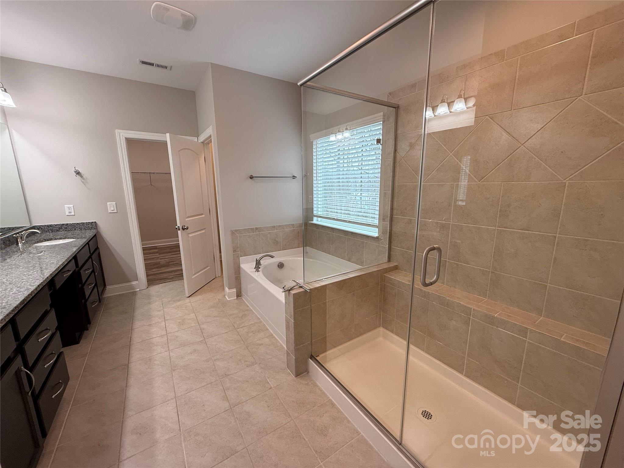 1073 Moonlight Mist Road Belmont, NC 28012 - Photo 7 of 20 a bathroom with a tub sink and mirror