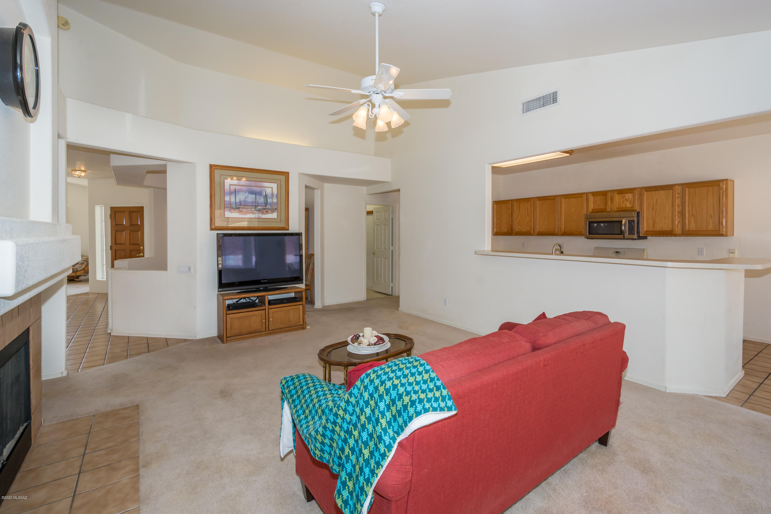 11341 Silver Pheasant Loop Oro Valley, AZ 85737 - Photo 11 of 41 a living room with furniture and a flat screen tv