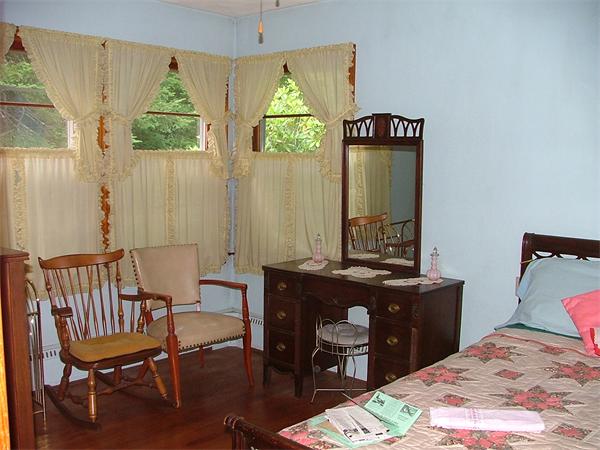 1446 Ashfield Road Conway, MA 01341 - Photo 15 of 23 a bedroom with a bed and a table in it