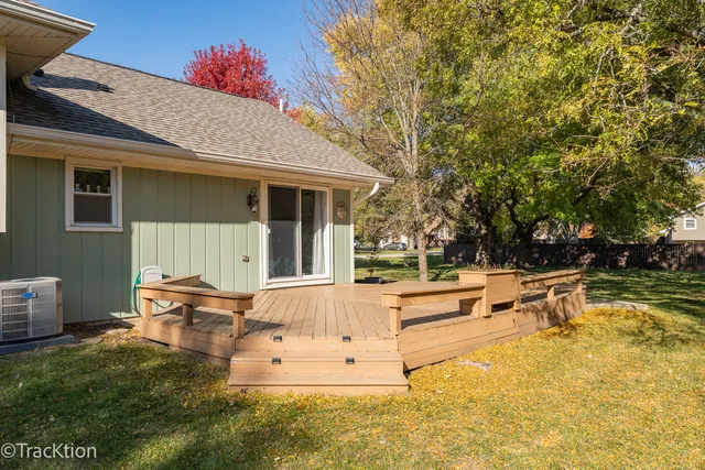 a view of a house with backyard porch and sitting area