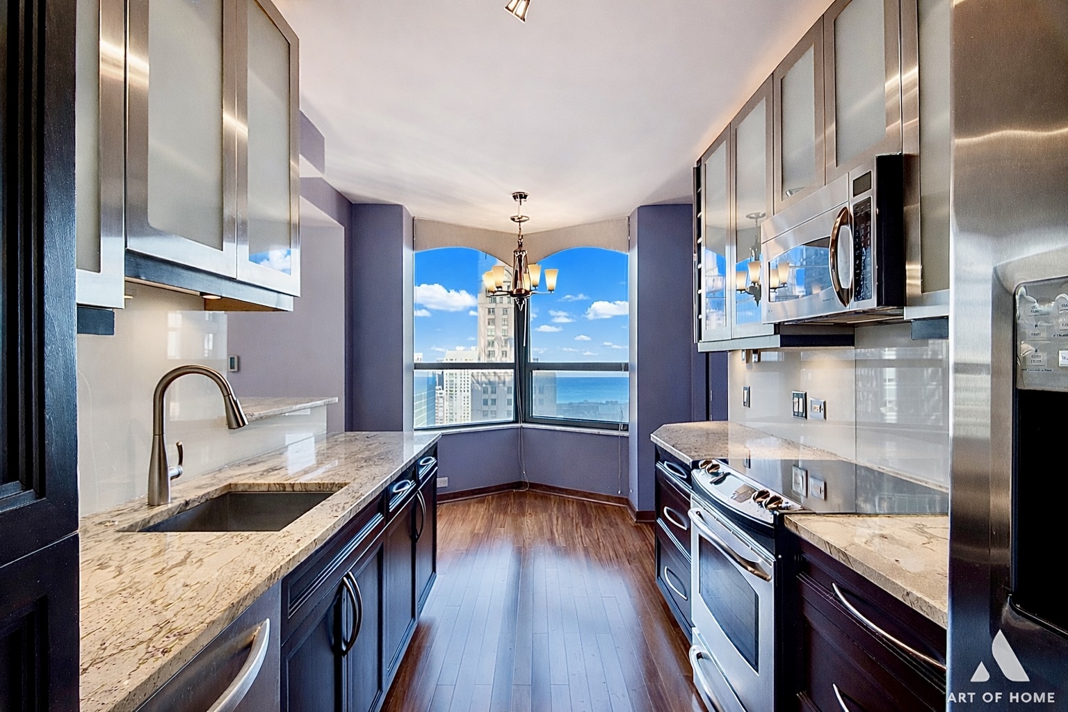 400 East Ohio Street, Unit 2902 Chicago, IL 60611 - Photo 12 of 34 a kitchen with stainless steel appliances granite countertop a sink and a stove