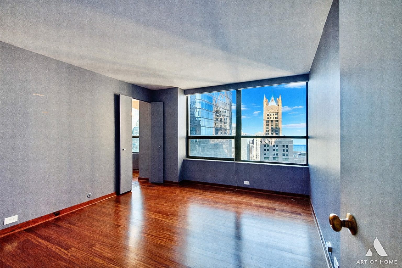 400 East Ohio Street, Unit 2902 Chicago, IL 60611 - Photo 14 of 34 wooden floor in an empty room with a window
