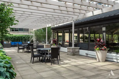 a view of a patio with couches and a table and chairs