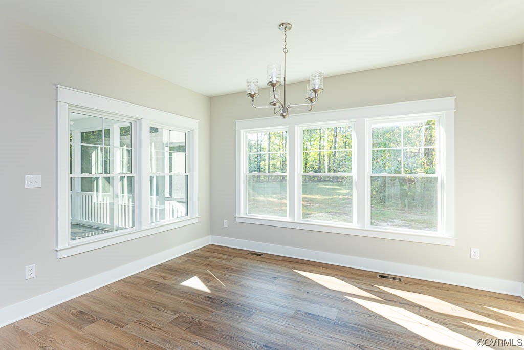 8473 Lincoln Road Mechanicsville, VA 23116 - Photo 11 of 46 a view of an empty room with a window and wooden floor