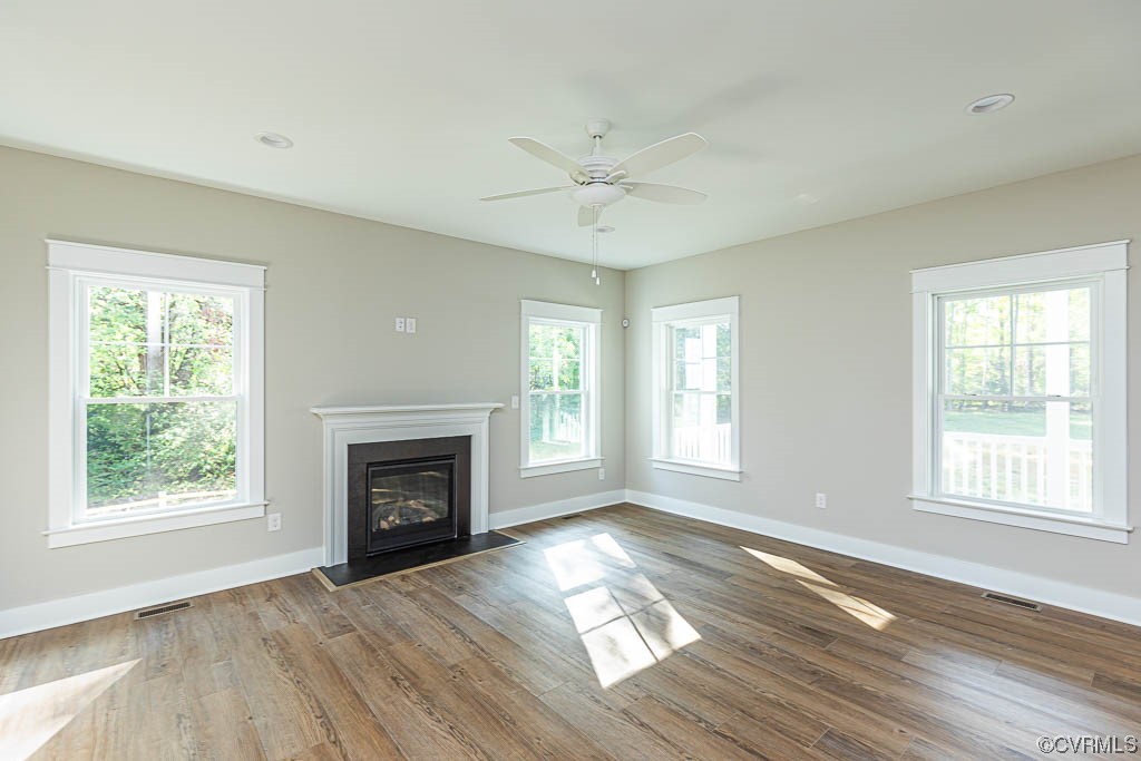 8473 Lincoln Road Mechanicsville, VA 23116 - Photo 13 of 46 a view of an empty room with wooden floor fireplace and a window