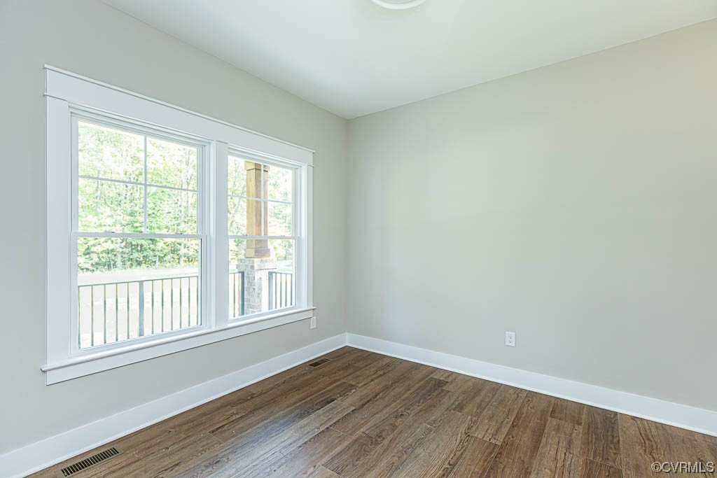 8473 Lincoln Road Mechanicsville, VA 23116 - Photo 18 of 46 an empty room with wooden floor and windows